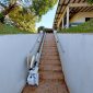 Folded-Bespoke-Synergy-Straight-Stairlift-Outside-Home