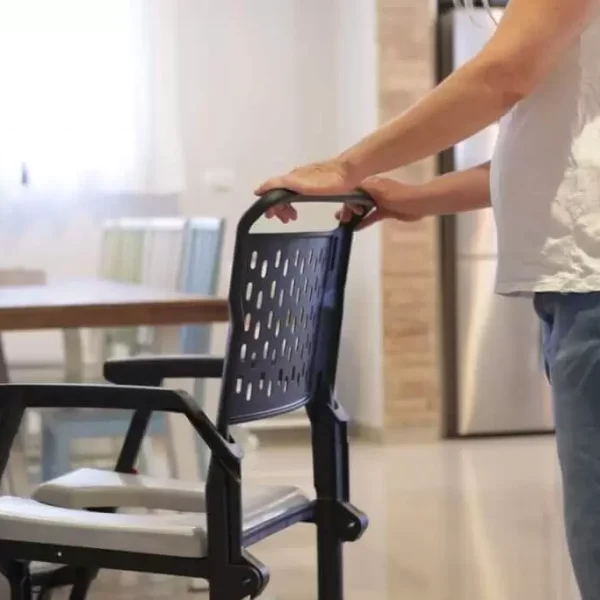 Man-Placing-Hand-on-Bathmobile-Commode-Shower-Chair.webp Man-Placing-Hand-on-Bathmobile-Commode-Shower-Chair.webp