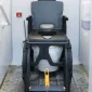 WheelAble-Travelling-Commode-and-Shower-Chair-in-Toilet.webp