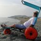 Old-Man-Sitting-on-Star-Beach-Water-Wheelchair.jpeg