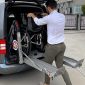 Person-Putting-Wheelchair-Using-Double-Arm-Baby-Van-Lift.jpeg