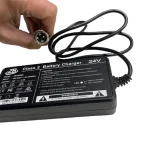 Person Holding Air Hawk Electric Wheelchair Charger
