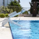 Fixed Pool Transfer Lift Device Seat Completely Inside Swimming Pool Rightside View