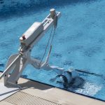 Fixed Pool Transfer Lift Device Seat Completely Inside Swimming Pool Near View