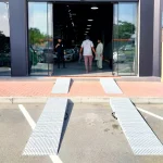 Slip-Resistant Wheelchair Ramp Installed Infront of Car Dealership