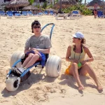Person Sitting on Hippocampe – The Versatile All-terrain Beach Wheelchair