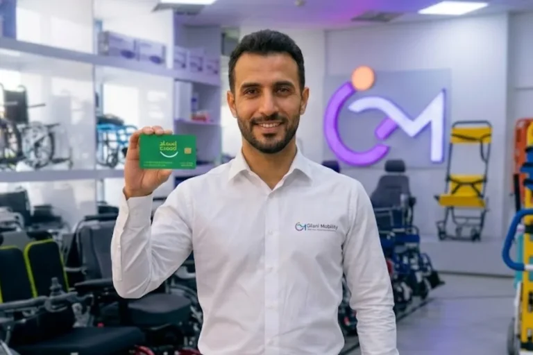 Person Holding Esaad Card - Gilani Mobility