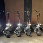 Vostok WTF Electric Scooter Front View With Lights On