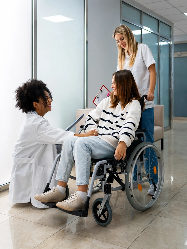 Doctor talking to patient in wheelchair